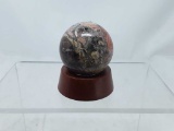 SMALL DECORATIVE ONYX BALL ON WOOD STAND