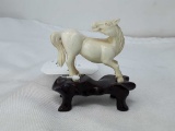 MINIATURE HORSE CARVED FROM BONE ON STAND