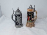 2 LIDDED GERMAN STEINS 1 W/MUSIC BOX