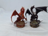2 NUMBERED TREASURE DRAGONS EACH HOLDING A 
