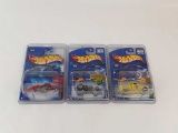 3 HOT WHEELS NEW IN PACKAGE W/HARD CASES