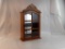 SMALL CURIO GLASS PANELED CABINET.