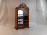 SMALL CURIO GLASS PANELED CABINET.