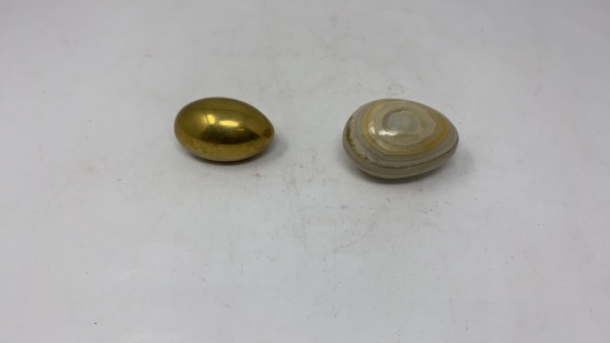 2 EGG SHAPED PAPERWEIGHTS, STONE & BRASS