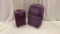 Set of 2 Purple Rolling Luggage Pieces.