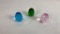 3 FACETED EGG PAPERWEIGHTS, BLUE, PINK, & GREEN