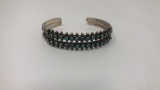 STERLING SILVER AND TURQUOISE BRACELET.