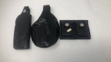 2 BLACK LEATHER HOLSTERS AND AMMO HOLDER.