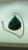 STERLING SILVER AND TURQUOISE COLORED NECKLACE. .