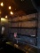METAL AND GLASS LIT WALL SHELVING.