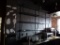 METAL AND GLASS LIT WALL SHELVING.