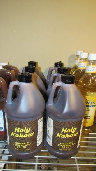 6) BOTTLE OF HOLY KAKOW CHOCOLATE SAUCE.