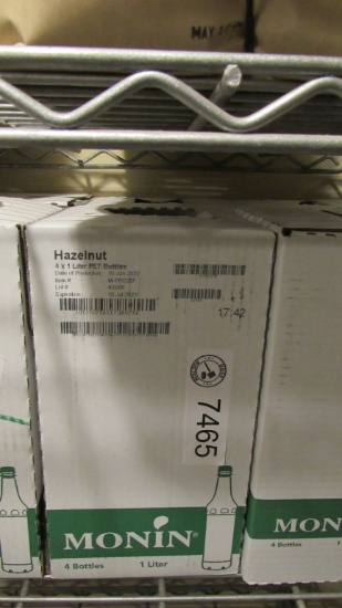 8) BOTTLES OF MONIN HAZELNUT GOURMET SYRUP.