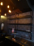 METAL AND GLASS LIT WALL SHELVING.