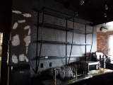 METAL AND GLASS LIT WALL SHELVING.