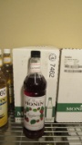 5) BOTTLES OF MONIN RASPBERRY GOURMET SYRUP.