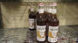12) BOTTLES OF MONIN HONEY GOURMET SYRUP.