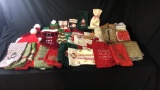 COLLECTION OF CHRITMAS TEA TOWELS, STOCKNGS, & HAT