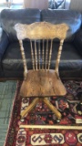 ANTIQUE ROLLING WOOD OFFICE CHAIR.