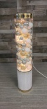 DECORATIVE TOWER OF PLASTIC ORNAMENTS
