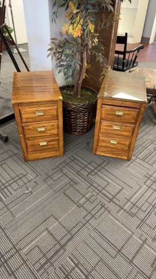 Set of two wood filing cabinets.