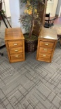 Set of two wood filing cabinets.