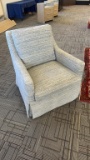 UPHOLSTERED SWIVEL ROCKING CHAIR