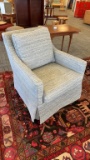 UPHOLSTERED SWIVEL ROCKING CHAIR