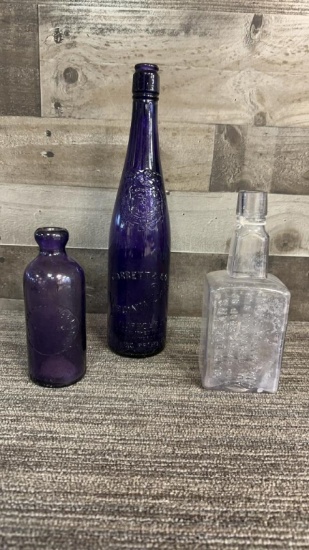 ANTIQUE AMETHYST GLASS EMBOSSED BOTTLES