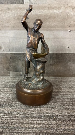 BRONZE SCULPTURE OF A BLACKSMITH