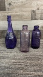 ANTIQUE AMETHYST GLASS EMBOSSED BOTTLES