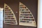 Lot of 2 Sailboat Shaped Merchandising Racks with Approx. 100+- Bottles of Nail Polish