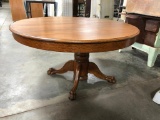 Antique Round Oak Table w/ Claw Feet and Six Leaves, 29