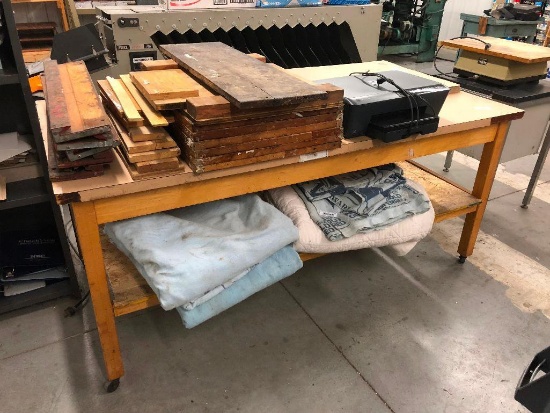 Two Work Tables and Stack of Wood