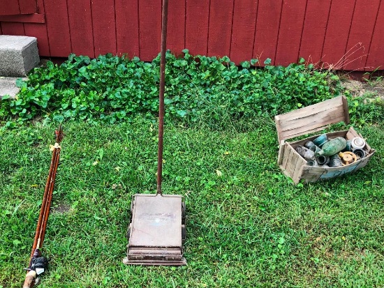 Old Vacuum and Bamboo Fishing Pole