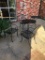 Five Wrought Iron Patio Tables, Six Wrought Iron Patio Chairs (Front of Hotel)