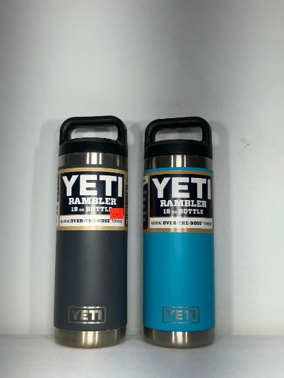 (2) Yeti Rambler 18oz Bottle Charcoal MSRP: $29.99, Yeti Rambler 18oz Bottle Reef Blue MSRP: $29.99