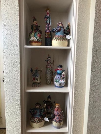 Three Shelves of Jim Shore Christmas Collectibles