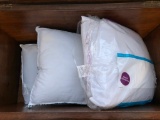 Three brand new pillows
