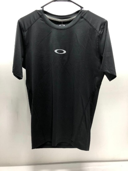 Lot of 2 Items: (1) Oakley Large White Motion SS Top, (1) Oakley Large Black Motion SS Compression