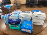 Table Full of Unused Adult Diapers - Small and Medium