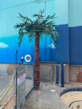 Two Artificial Palm Trees and an Artificial Plant
