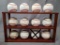 (11) Baseballs w/ Autographs by Gaylord Perry, Jason Varitek, Dennis Rasmussen & Display Stand