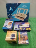 Group of New Items: Desk Easel, Blood Pressure Monitor, Handheld Sewing Machine, Pencil Sharpener,