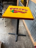 High Top Table: Single Pedestal Base, Yellow HD Lacquer Top w/ Fuzzy's Taco Shop Logo, 42in T 22in