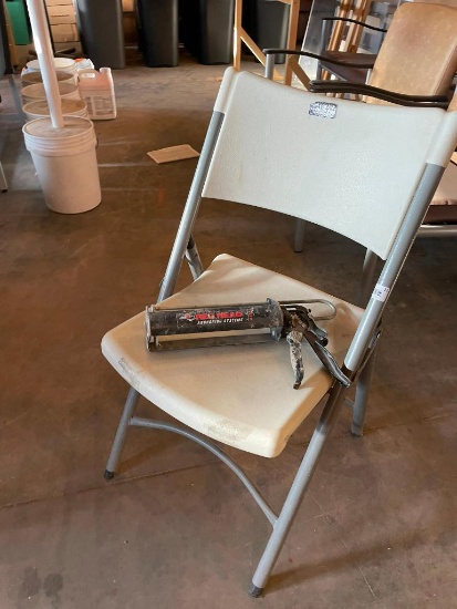 Folding Chair and Red Head Caulk Gun