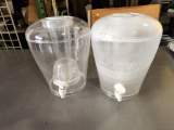 2 Drink Dispensers w/ Stands, 1 is a bit faded, 1 good and clear