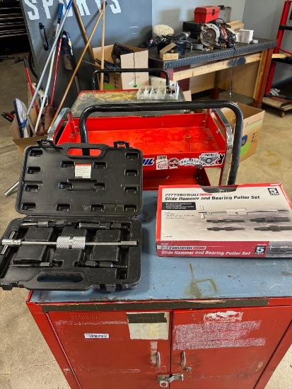 One new and one used Slide Hammer & Bearing Puller Set