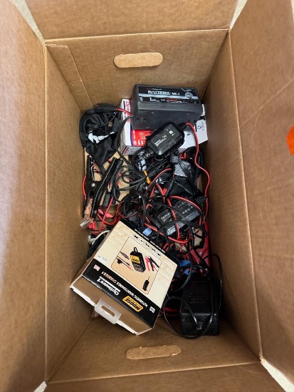 Box of Used Battery Chargers and Cables