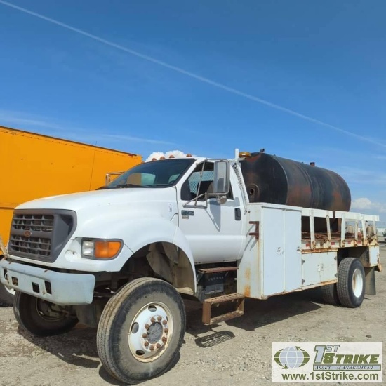 FLAT BED TRUCK, 2002 FORD F-750, 5.9L CUMMINS, MANUAL TRANSMISSION, MARMON-HARRINGTON 4X4, SINGLE RE